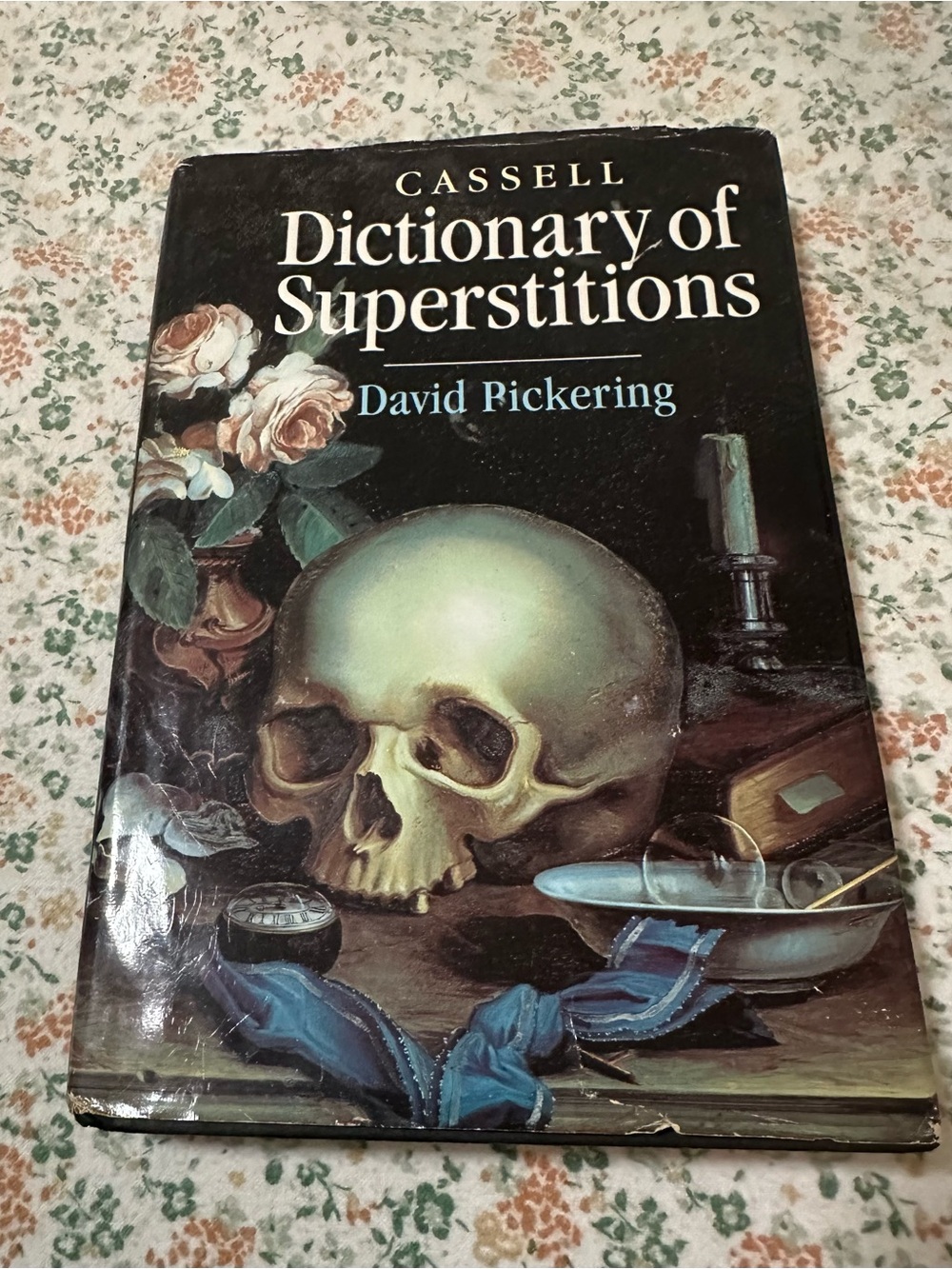Source Unknown Black Cover Book with Skull Illustration